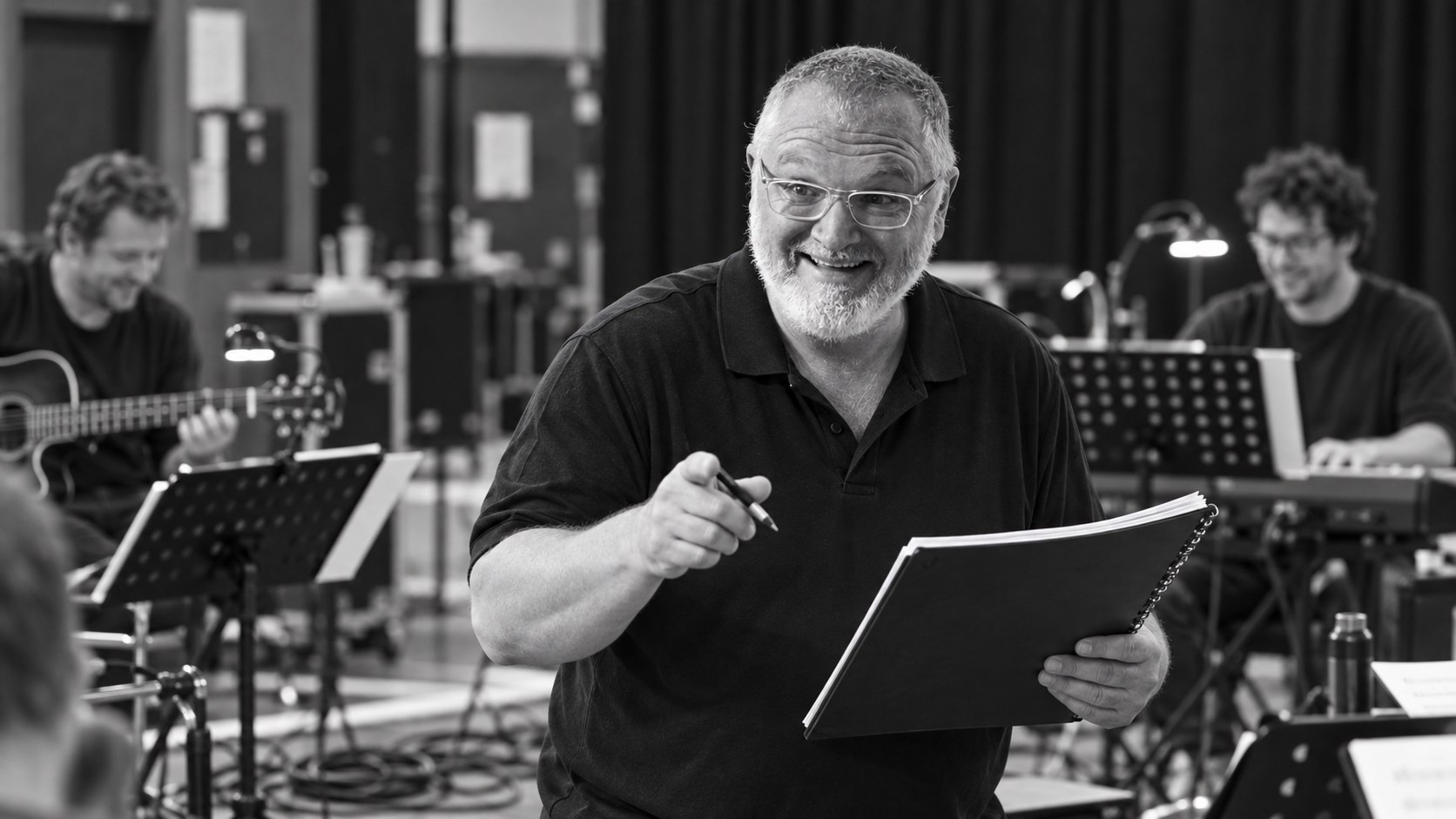 Creative portrait of Gary directing a rehearsal
